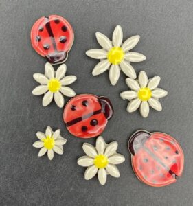 ceramic bugs and flowers