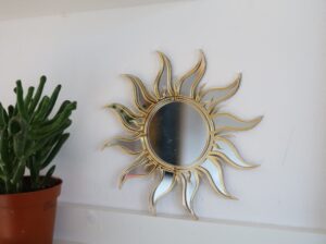 sun shaped mirror, sunset-themed bedroom decor